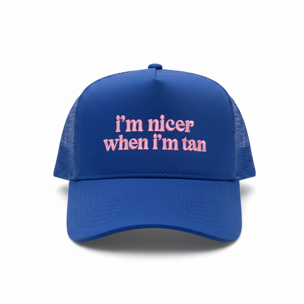 Royal blue trucker hat with pink embroidered i'm nicer when i'm tan text