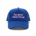Royal blue trucker hat with pink embroidered i'm nicer when i'm tan text